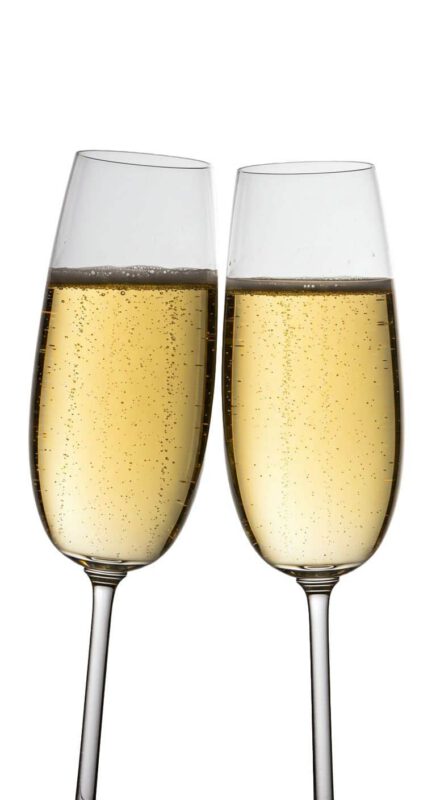 A Guide to Choosing the Perfect Champagne for Any Occasion|Pop the Cork: A Guide to Choosing the Perfect Champagne for Any Occasion - Smart Hospitality Supplies|||||||||||close up photo of 2 champagne glasses showing bubbles||2 champagne glasses filled with champagne